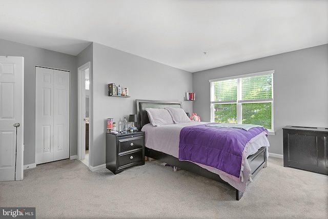carpeted bedroom with baseboards