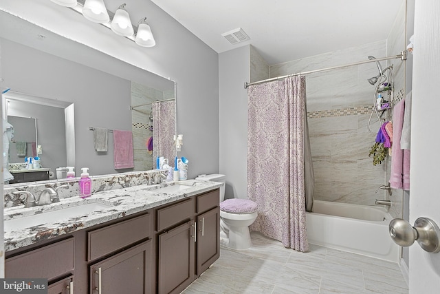 full bathroom with a sink, toilet, shower / tub combo, and visible vents