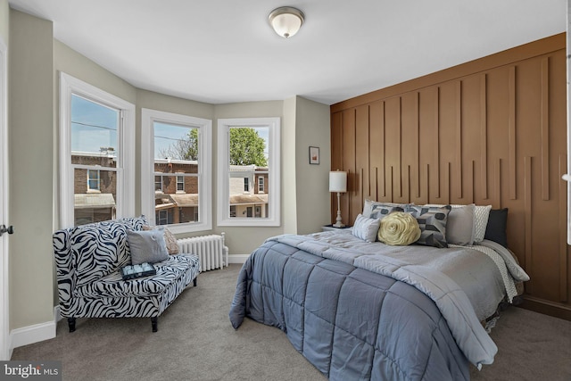 226 N 64th St, Philadelphia, PA 19139 - carpeted bedroom featuring baseboards and radiator