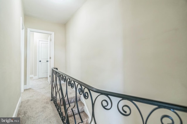 226 N 64th St, Philadelphia, PA 19139 - hall featuring carpet flooring, baseboards, and an upstairs landing