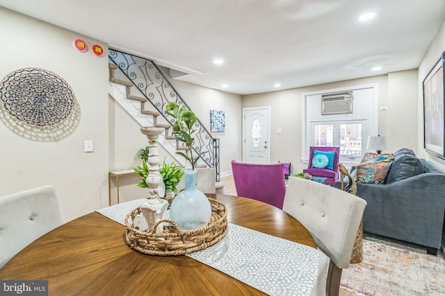 226 N 64th St, Philadelphia, PA 19139 - dining room with stairway, a wall unit AC, and recessed lighting