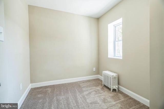 226 N 64th St, Philadelphia, PA 19139 - empty room featuring radiator heating unit, carpet floors, and baseboards