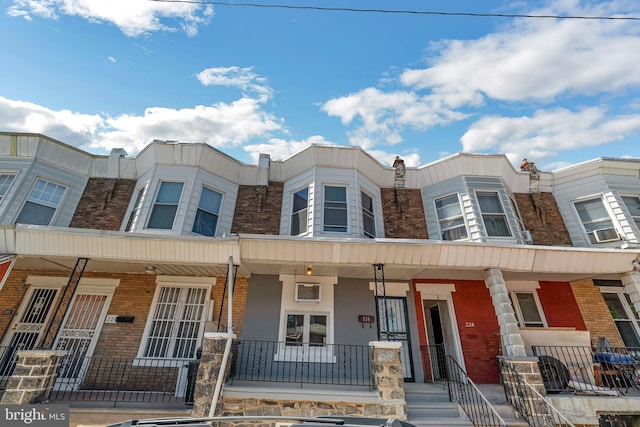 226 N 64th St, Philadelphia, PA 19139 - townhome / multi-family property featuring covered porch and brick siding