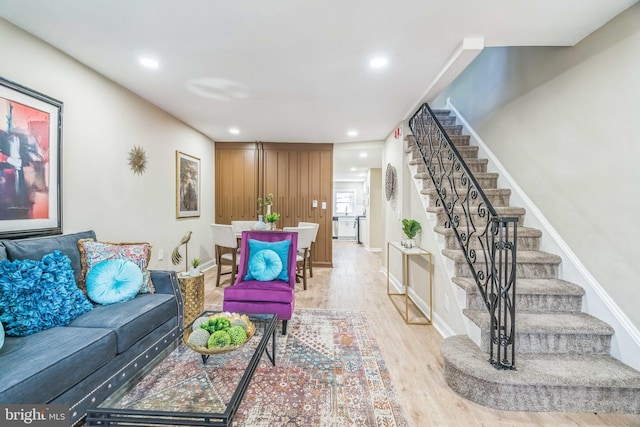 226 N 64th St, Philadelphia, PA 19139 - living room with recessed lighting, light wood-style flooring, baseboards, and stairway