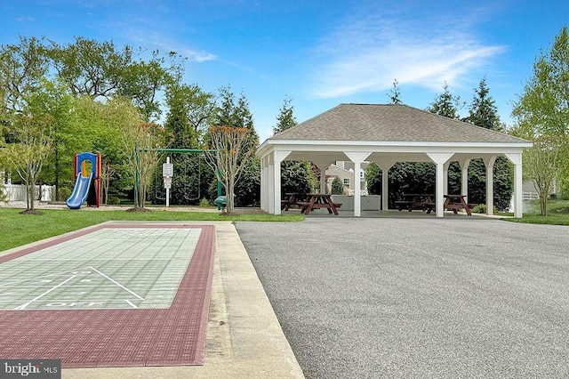 view of property's community featuring a gazebo, playground community, and shuffleboard