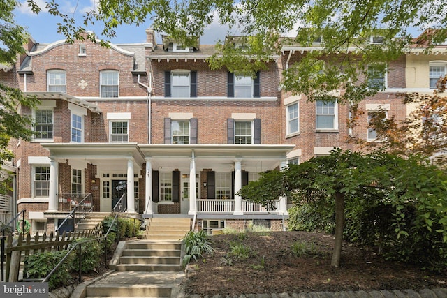 1847 Lamont St NW, Washington, DC 20010 - view of property featuring brick siding and a porch
