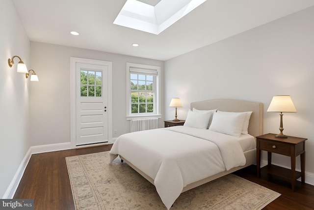 1847 Lamont St NW, Washington, DC 20010 - bedroom featuring a skylight, radiator heating unit, dark wood-type flooring, and recessed lighting