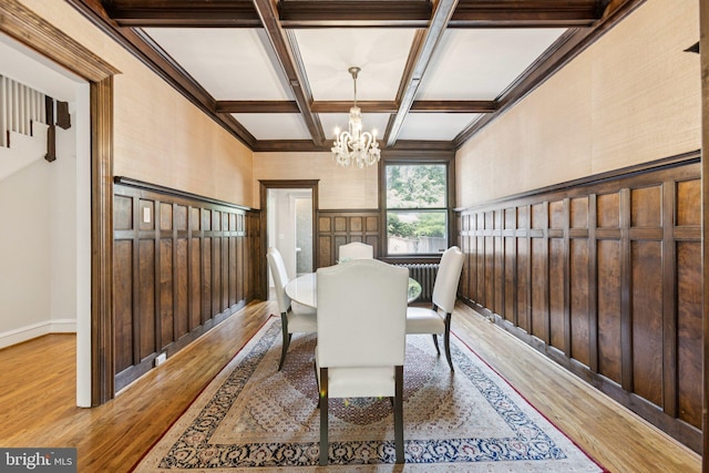 1847 Lamont St NW, Washington, DC 20010 - dining area with light wood finished floors, a chandelier, coffered ceiling, and beamed ceiling