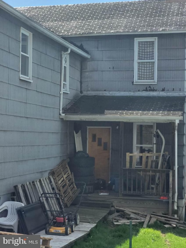 back of house featuring a deck