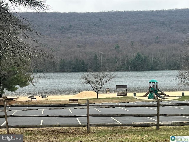 water view featuring a wooded view