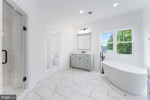 4763 Williamsburg Blvd, Arlington, VA 22207 - full bath with a stall shower, vanity, recessed lighting, a freestanding bath, and toilet