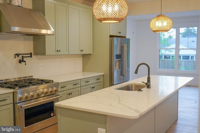 4763 Williamsburg Blvd, Arlington, VA 22207 - kitchen featuring extractor fan, high quality appliances, a sink, a kitchen island with sink, and light wood-style floors