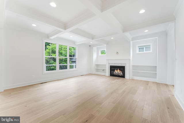 4763 Williamsburg Blvd, Arlington, VA 22207 - unfurnished living room featuring beam ceiling, light wood-type flooring, coffered ceiling, a glass covered fireplace, and baseboards