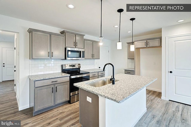 325 Magnolia Ln Lot 103, State College, PA 16803 - kitchen with a sink, backsplash, stainless steel appliances, and light wood finished floors