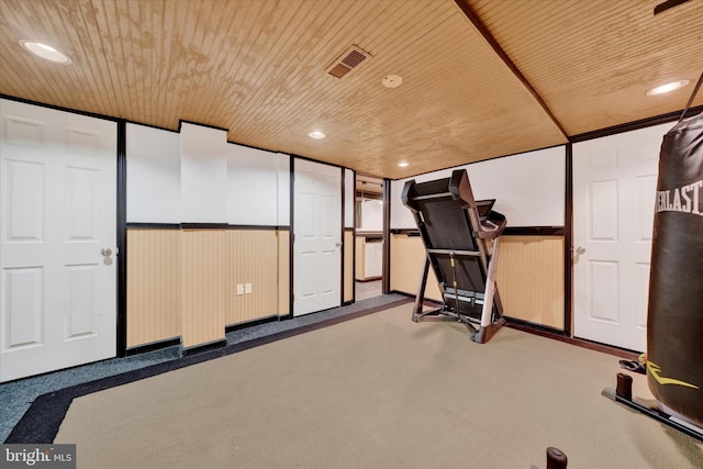 workout area featuring wood ceiling, carpet floors, and recessed lighting