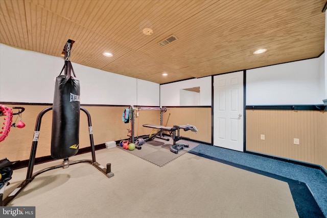 exercise room featuring visible vents, recessed lighting, carpet floors, wood ceiling, and baseboards