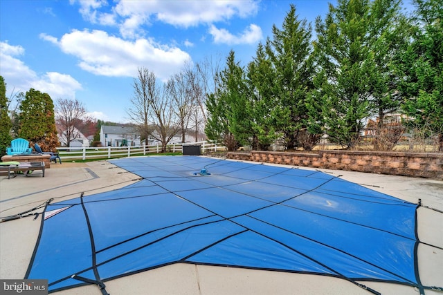 view of pool featuring a patio, fence, and a fenced in pool