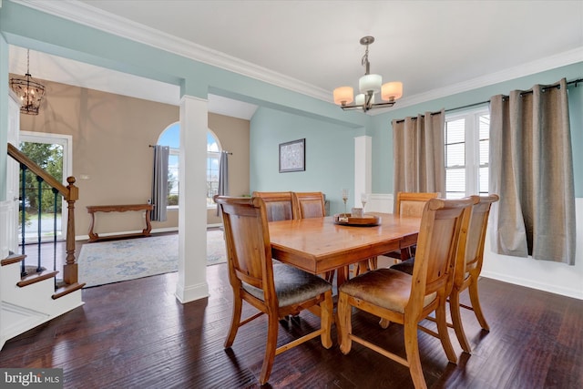 dining room with an inviting chandelier, stairs, a wealth of natural light, and crown molding