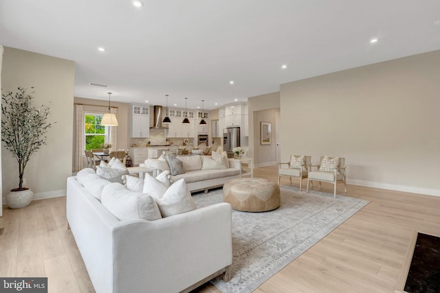 40928 Arcadian Pond Ct, Aldie, VA 20105 - living area with light wood-style flooring, baseboards, and recessed lighting
