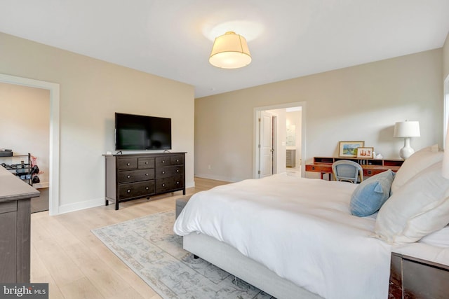 40928 Arcadian Pond Ct, Aldie, VA 20105 - bedroom with light wood-style flooring, baseboards, and connected bathroom