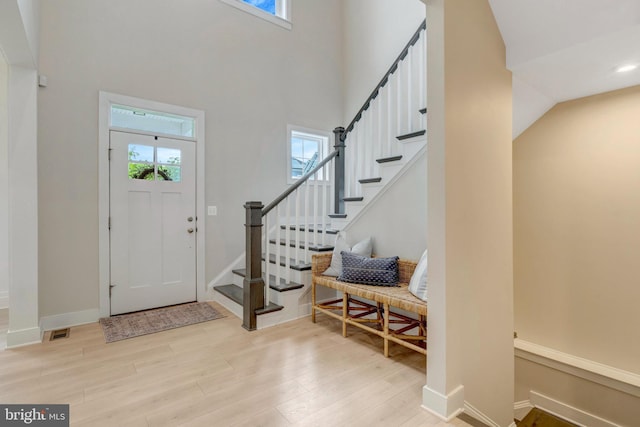 40928 Arcadian Pond Ct, Aldie, VA 20105 - entryway featuring wood finished floors, a towering ceiling, stairway, baseboards, and recessed lighting