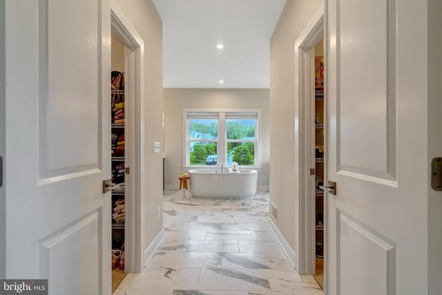 40928 Arcadian Pond Ct, Aldie, VA 20105 - hallway with light marble finish floors, baseboards, and recessed lighting