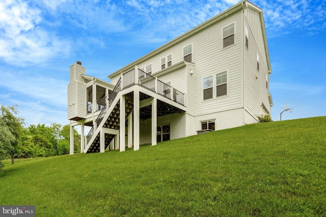 40928 Arcadian Pond Ct, Aldie, VA 20105 - rear view of house featuring a wooden deck, stairway, a yard, and a chimney