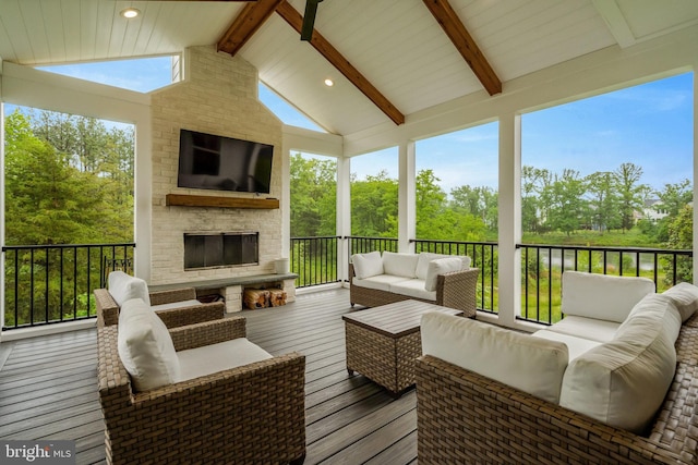 40928 Arcadian Pond Ct, Aldie, VA 20105 - wooden terrace with an outdoor living space with a fireplace and view of wooded area