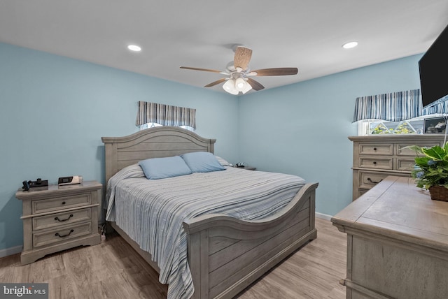 bedroom with ceiling fan, multiple windows, light wood-style floors, recessed lighting, and baseboards