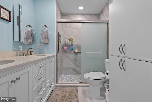full bathroom featuring toilet, recessed lighting, a shower stall, and vanity