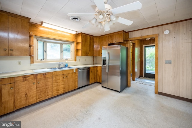 1321 Marsh Hill Rd, Mc Henry, MD 21541 - kitchen with stainless steel appliances, healthy amount of natural light, brown cabinets, a sink, and wooden walls