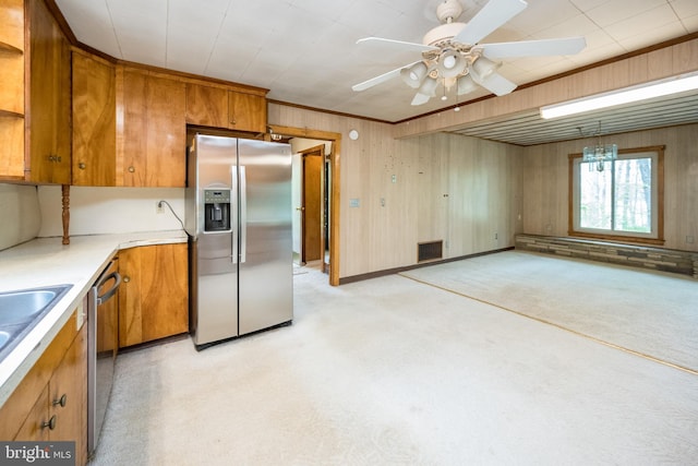 1321 Marsh Hill Rd, Mc Henry, MD 21541 - kitchen with appliances with stainless steel finishes, brown cabinets, light countertops, light carpet, and wood walls