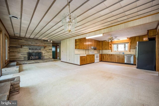 1321 Marsh Hill Rd, Mc Henry, MD 21541 - unfurnished living room featuring light carpet, a fireplace, a ceiling fan, and wood walls