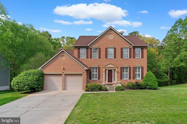 colonial house featuring brick siding, driveway, a front lawn, and a garage
