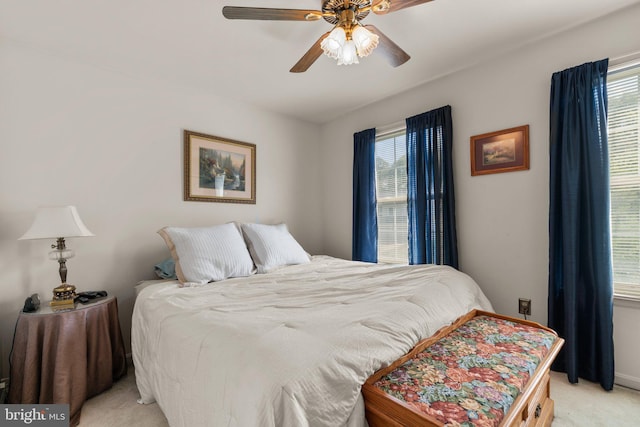 bedroom featuring ceiling fan and light colored carpet