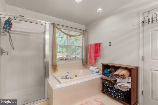 bathroom with a jetted tub, tile patterned flooring, a shower stall, and recessed lighting