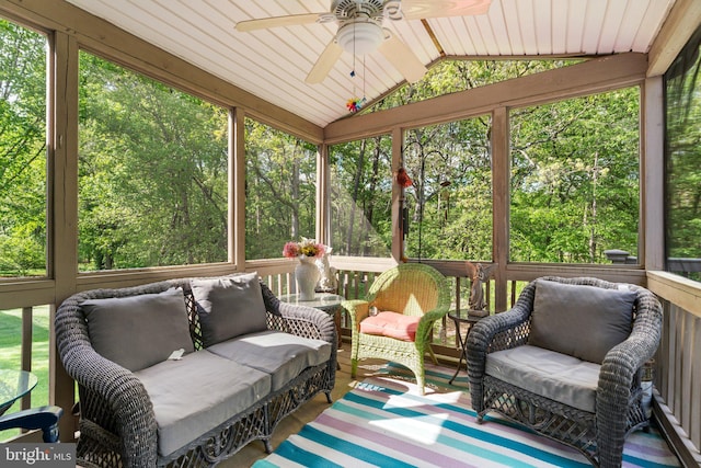 sunroom / solarium with ceiling fan and outdoor lounge area