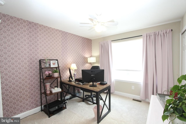 office with baseboards, a ceiling fan, light colored carpet, and wallpapered walls