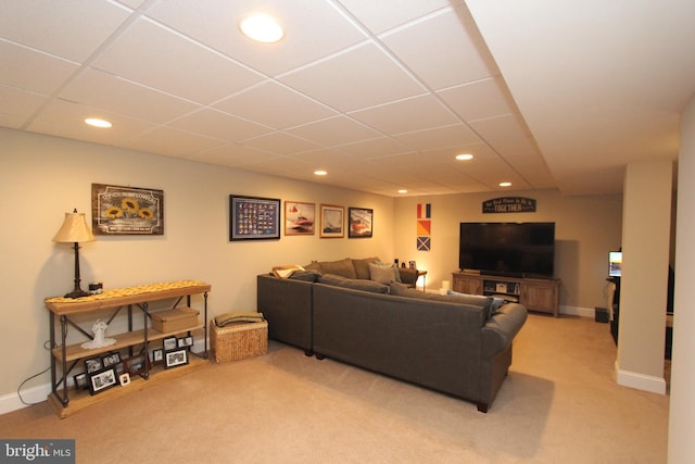 living area featuring recessed lighting, baseboards, a drop ceiling, and carpet flooring