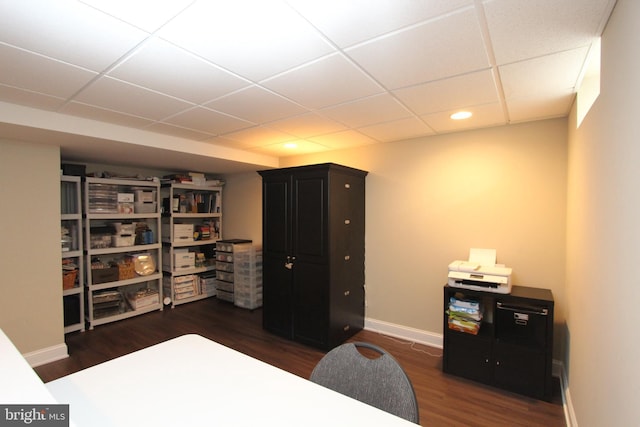 bedroom with baseboards, a drop ceiling, recessed lighting, and wood finished floors