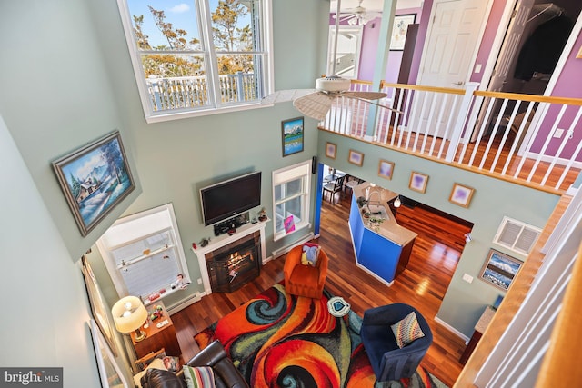 1511 Barnegat Ave, Ship Bottom, NJ 08008 - living area with plenty of natural light, a towering ceiling, wood finished floors, and ceiling fan