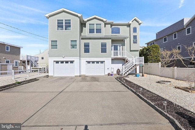 1511 Barnegat Ave, Ship Bottom, NJ 08008 - coastal inspired home featuring a garage, fence, driveway, and stairway