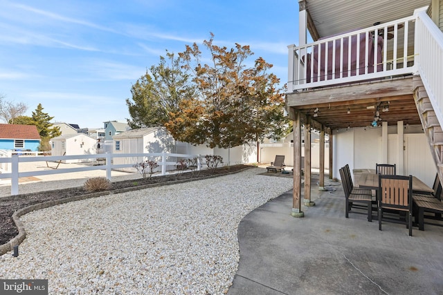 1511 Barnegat Ave, Ship Bottom, NJ 08008 - view of yard featuring a patio, a fenced backyard, outdoor dining area, a shed, and an outbuilding