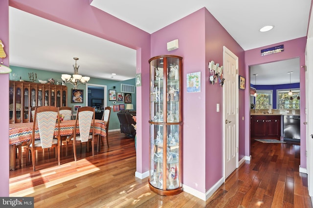 1511 Barnegat Ave, Ship Bottom, NJ 08008 - hallway with baseboards, an inviting chandelier, visible vents, and hardwood / wood-style floors