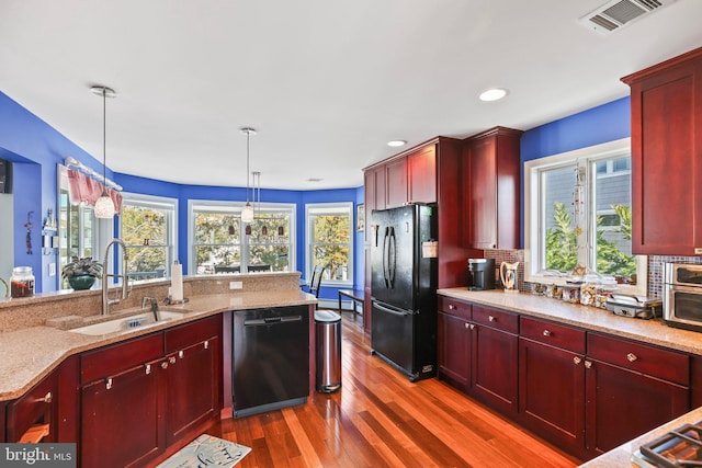 1511 Barnegat Ave, Ship Bottom, NJ 08008 - kitchen featuring dark wood-style flooring, dark brown cabinets, a sink, freestanding refrigerator, and dishwashing machine