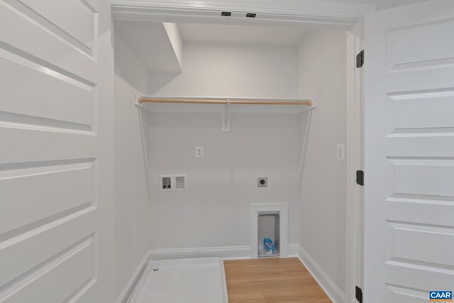 washroom featuring washer hookup, laundry area, electric dryer hookup, baseboards, and light wood-style flooring