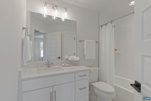 full bath featuring vanity, shower / bathtub combination with curtain, and toilet