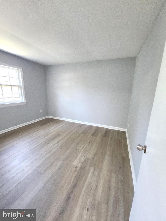 119 Hickok Cir, Fredericksburg, VA 22401 - empty room with baseboards, a textured ceiling, and wood finished floors