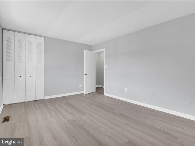 119 Hickok Cir, Fredericksburg, VA 22401 - unfurnished bedroom with visible vents, baseboards, wood finished floors, and a closet