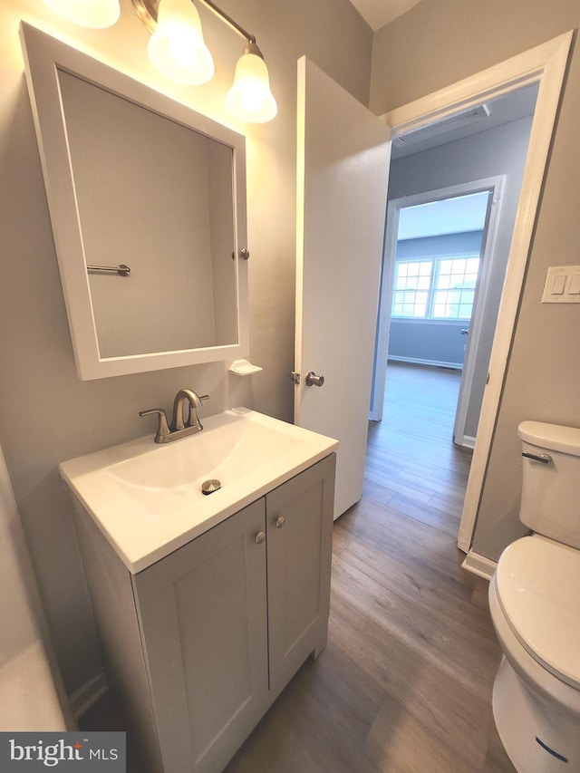 119 Hickok Cir, Fredericksburg, VA 22401 - half bathroom with vanity, wood finished floors, and toilet